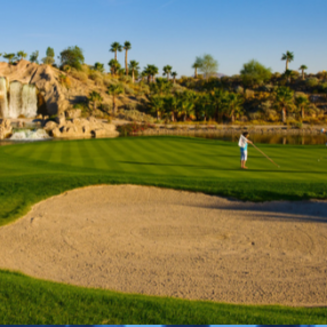 Aerial view of Eagle Falls Golf Course, featuring lush green fairways, surrounding desert landscape, and mountain backdrop.