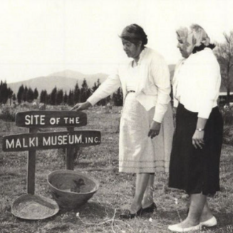 Image of Malki Museum and Temalpakh Garden entrance sign in Banning, California, surrounded by arid landscaping.