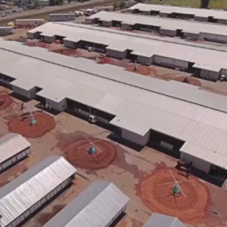 Aerial view of Emerald Downs racetrack, showing a large horse track, grandstand, and surrounding greenery in Auburn, Washington.